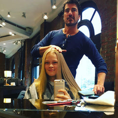RENEFRIS bottle pour demonstrates easy application and frizz control potential.