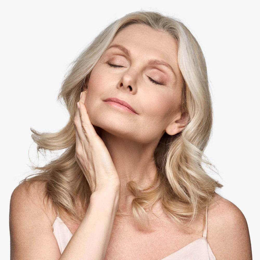 Replenix lifting-neck-cream application on neck demonstrates gentle massage absorption.