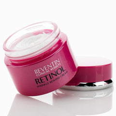 Reventin retinol night cream jar close-up showing luxurious texture.