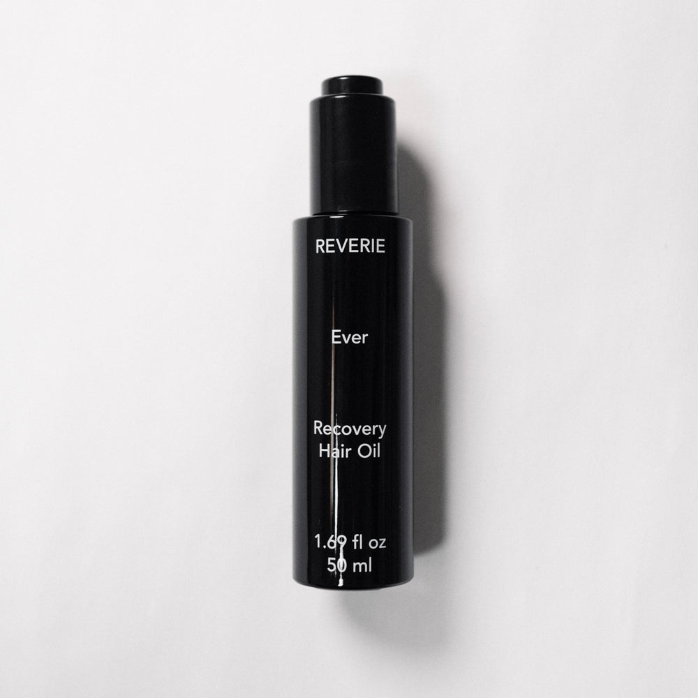 REVERIE Ever Recovery Oil on damp hair promotes a silky shine without heaviness.