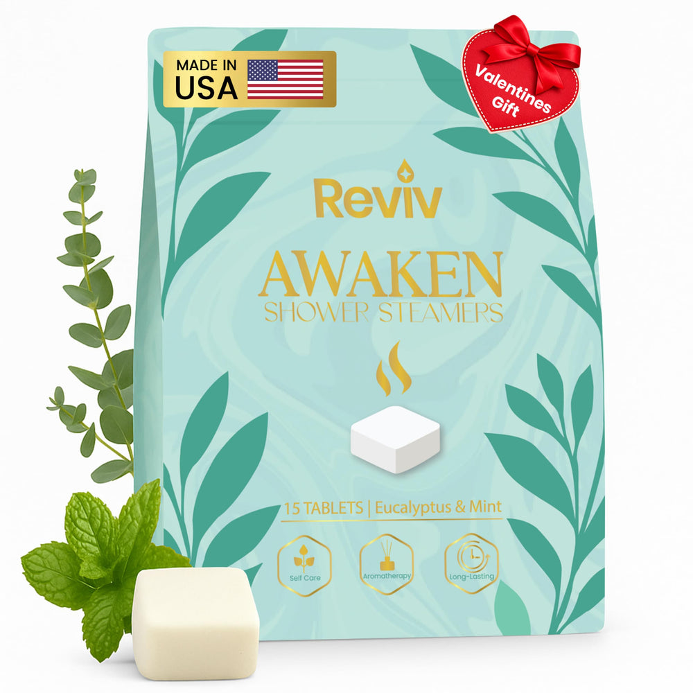 REVIV shower steamers set on a bathroom shelf for a spa-like self-care moment.