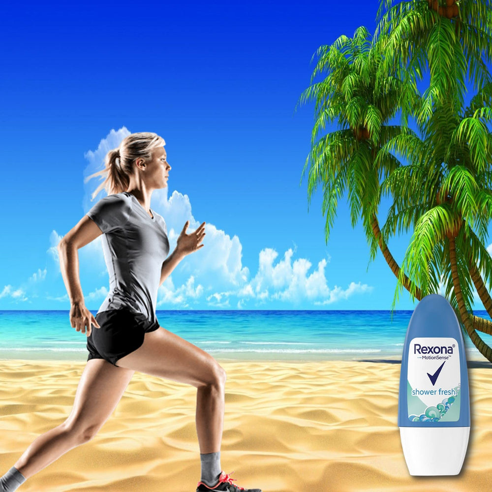 Rexona Shower Fresh bottle close-up during application highlights quick dry formula.
