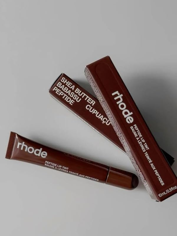 Rhode Gloss Lip Tint application delivering hydrated, sheer color.