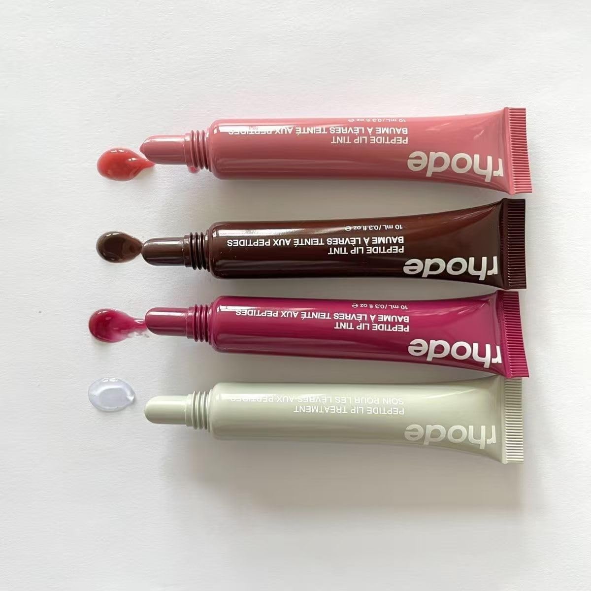 Lifestyle shot of Rhode Gloss Lip Tint Toast for everyday gloss