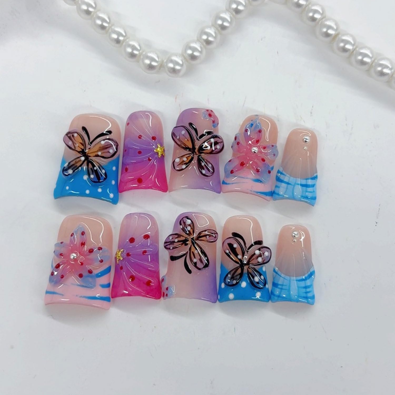 RIICFDD butterfly flower design nails shown in multiple sizes for a seamless fit