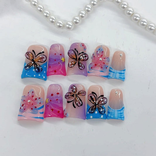 RIICFDD butterfly flower design nails shown in multiple sizes for a seamless fit