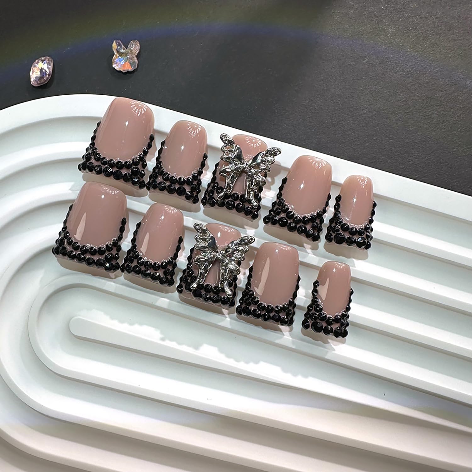 RIICFDD butterfly rhinestone design nails add sparkle for special occasions.