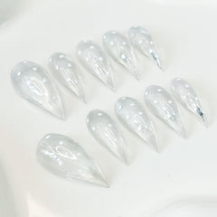 RIICFDD dot-design nails add subtle texture to everyday glam.