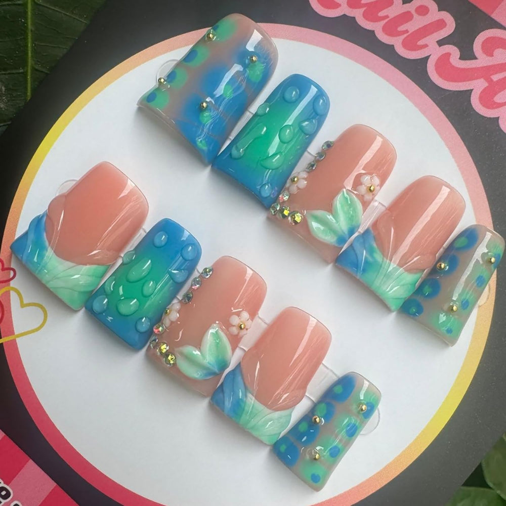 RIICFDD duck press nails with 3D flower rhinestones for a statement manicure.