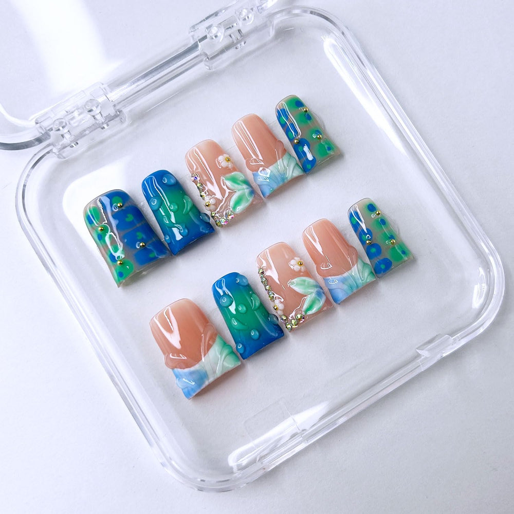 RIICFDD nails with a droplet pattern ready for quick, durable wear.