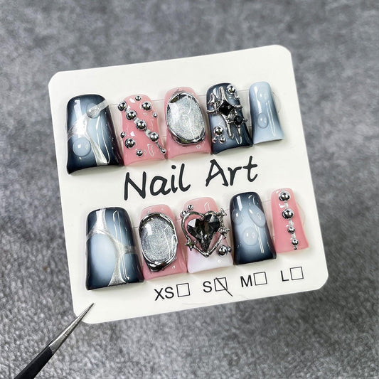 RIICFDD kit includes 10 nails, glue, cuticle stick, and travel pouch for on-the-go nails