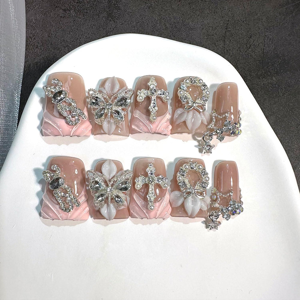 RIICFDD luxury duck press-on nails with butterfly rhinestones for instant glam.