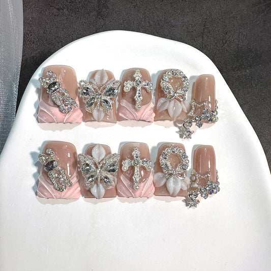 RIICFDD luxury duck press-on nails with butterfly rhinestones for instant glam.