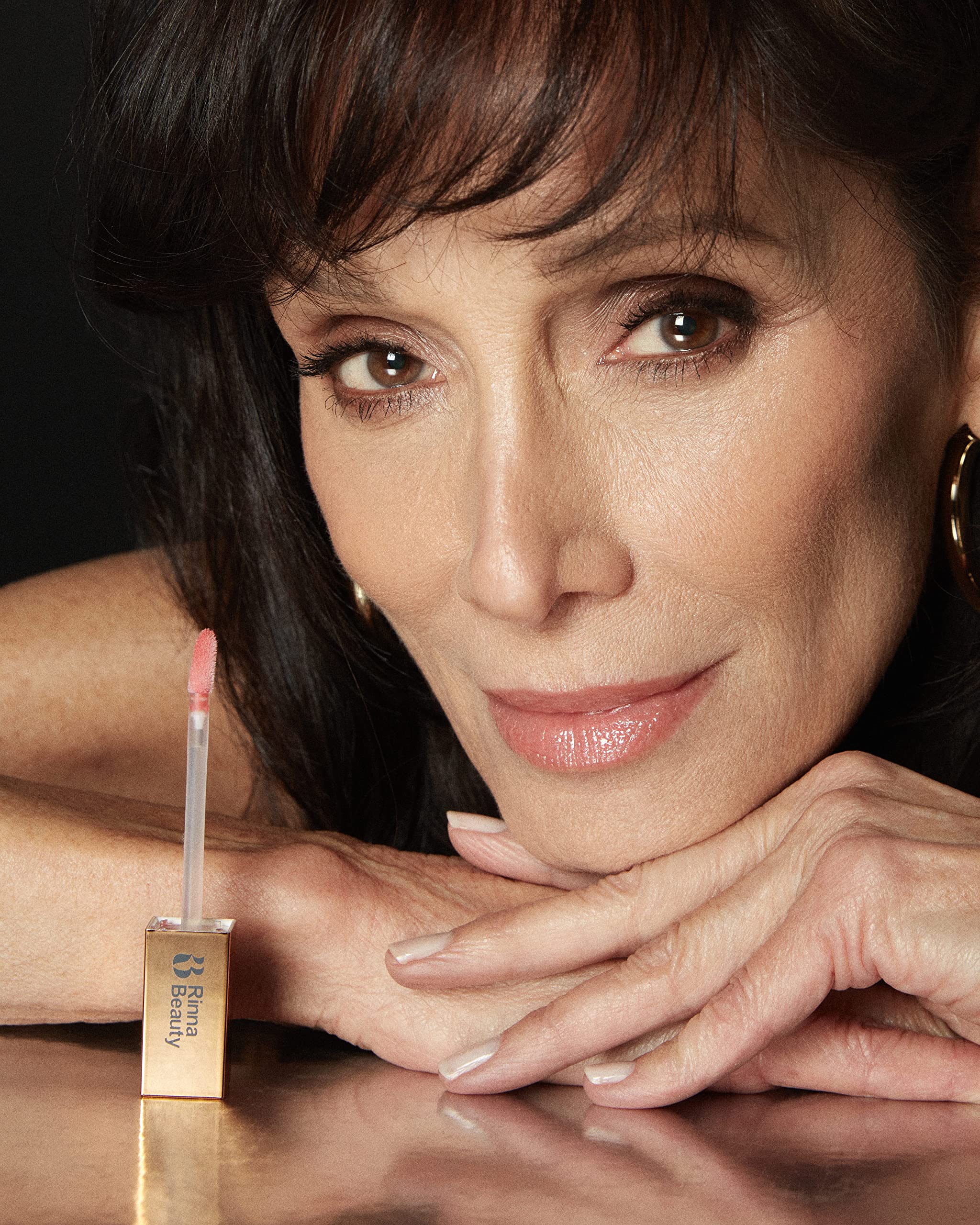 Cruelty-free lip gloss showcased in a sleek, premium tube.