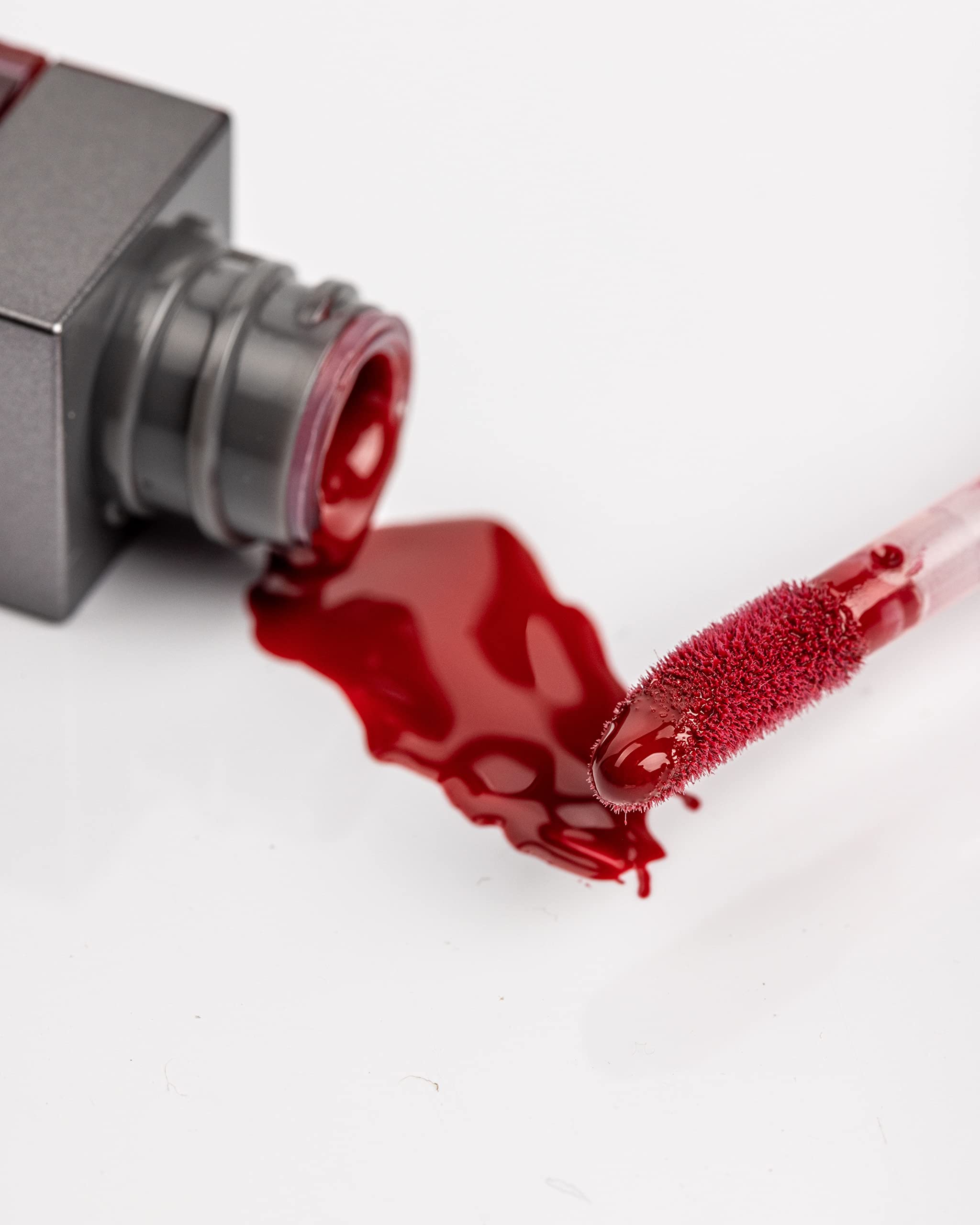 Rinna Beauty Hustle lip gloss applicator closeup demonstrates smooth, even application.