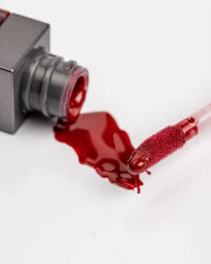 Rinna Beauty Hustle lip gloss applicator closeup demonstrates smooth, even application.