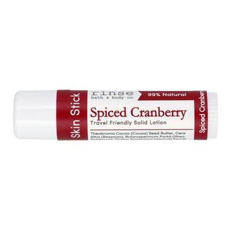 Rinse Spiced Cranberry solid lotion stick applied to dry skin for instant moisture