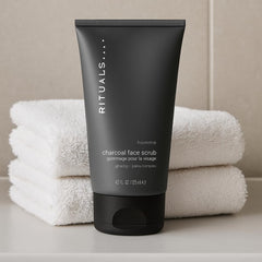 125ml jar of RITUALS Homme Charcoal Face Scrub displayed, convenient size for travel and home use.