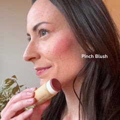 River Organics blush stick on lips for a subtle, hydrated color.