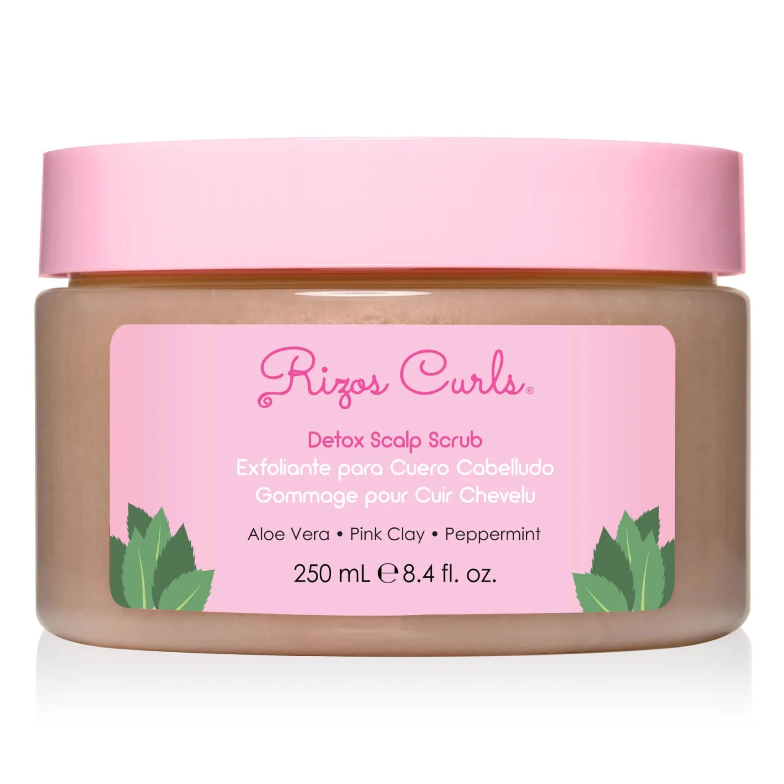 Rizos Curls Detox Scalp Scrub bottle pour shows smooth texture and cleansing benefits