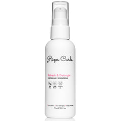 Rizos Curls Travel Refresh & Detangle Spray bottle on shelf for quick curl refresh.