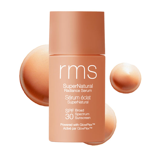 RMS Beauty Supernatural Radiance Serum SPF 30 bottle on vanity for daily glow.