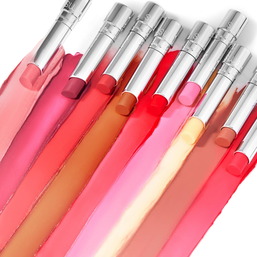 RMS Beauty Tinted Daily Lip Balm in handbag for on-the-go hydration.