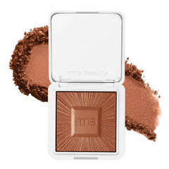 RMS Beauty Redimension Hydra-Bronzer compact closeup showing refillable eco-friendly design and portable glow.
