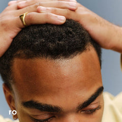 Close-up of Ro Men's Revive hair showing added volume.