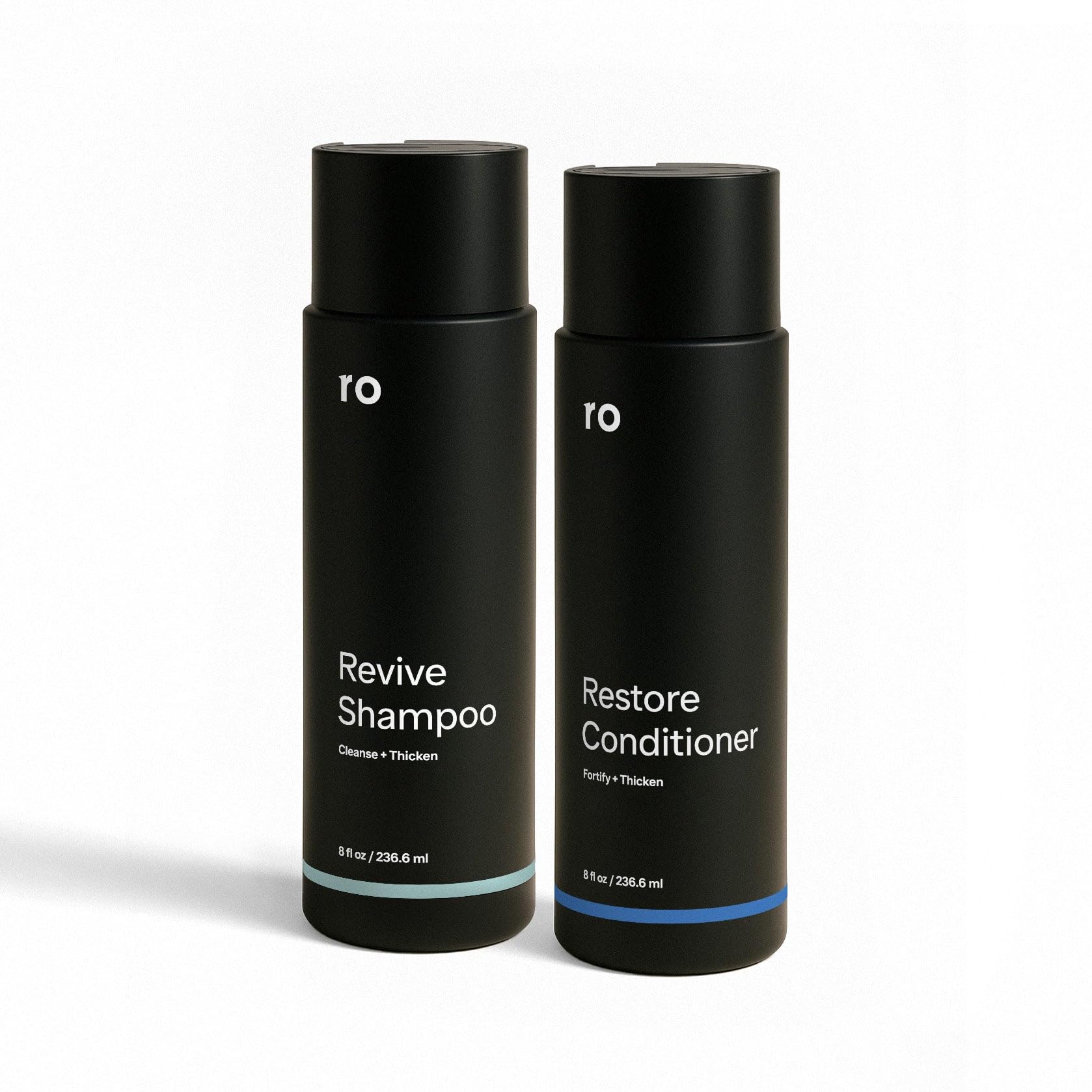 Ro Men's Revive Shampoo bottle on bathroom counter for thicker-looking hair.