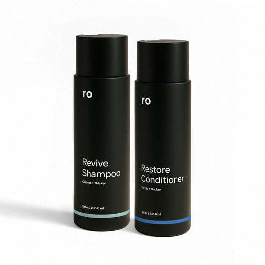 Ro Men's Revive Shampoo bottle on bathroom counter for thicker-looking hair.