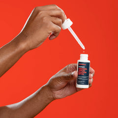 Ro Roman application on scalp showing precise dropper use