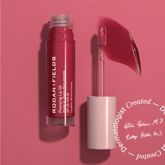 RODAN + FIELDS lip oil SPF 28 berry tint stroke highlighting lip definition.