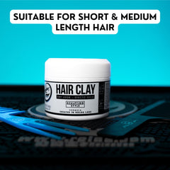 Hands scoop Rolda Hair Clay to begin shaping.
