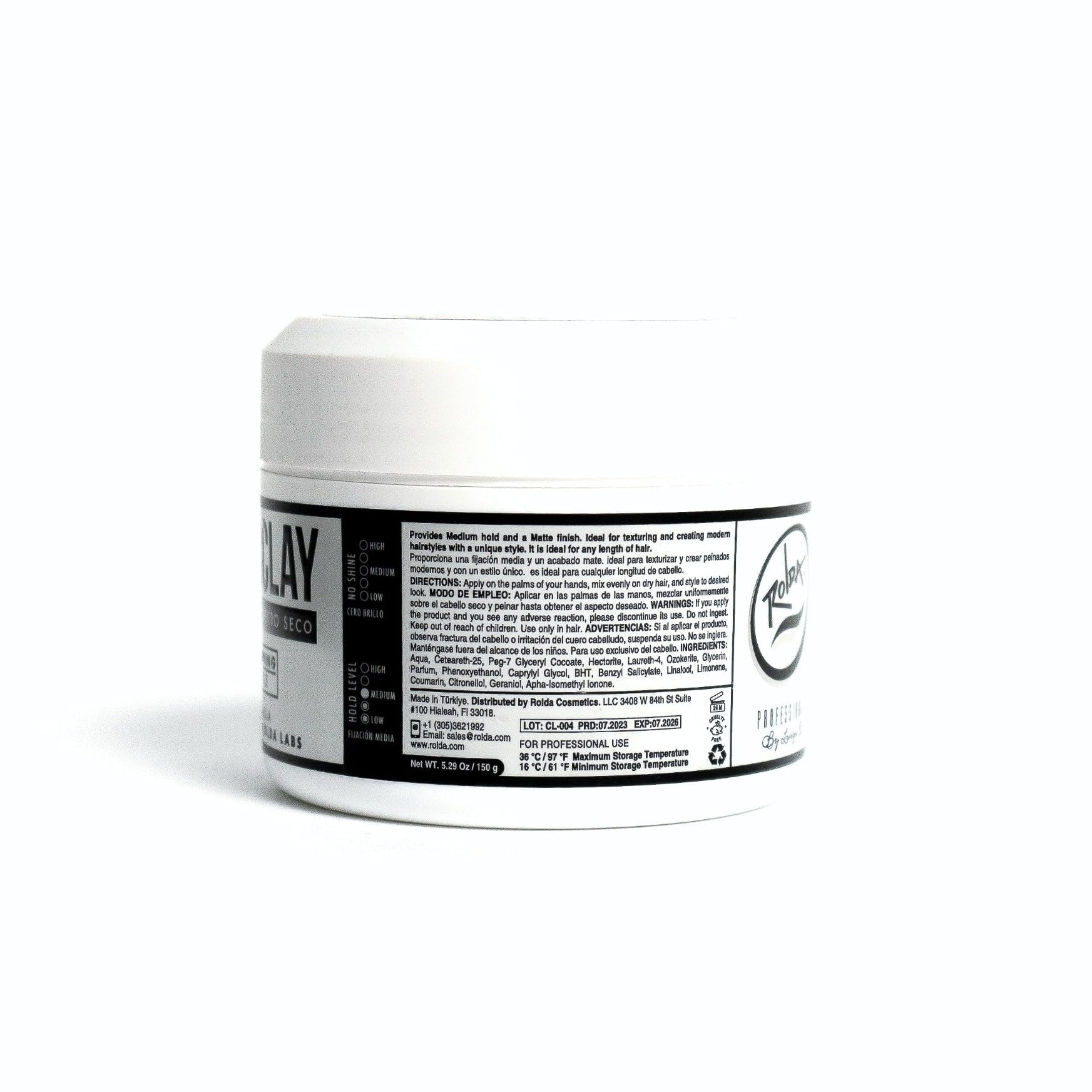 Lifestyle setup with Rolda Hair Clay on shelf nearby.