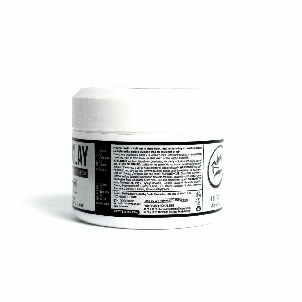 Lifestyle setup with Rolda Hair Clay on shelf nearby.