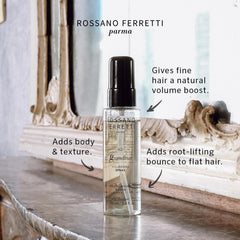 Grandioso Volumizing Spray mist applied to hair for lift and volume.
