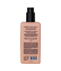 Applying Routine Deep Hair Conditioner to damp mid-length and ends