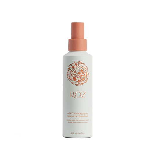 RŌZ Air Thickening Spray bottle closeup highlighting vegan formula and lightweight volume.