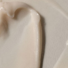 RŌZ Foundation Conditioner being applied by hands for smooth, manageable hair