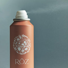 RŌZ Root Lift Spray applying on damp roots before drying for fullness.