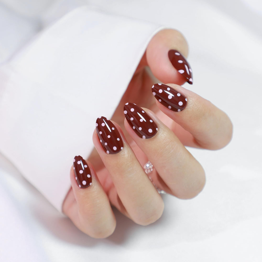 RPNZL Almond-shaped Berry nails with red polka dot UV coating for party-ready looks