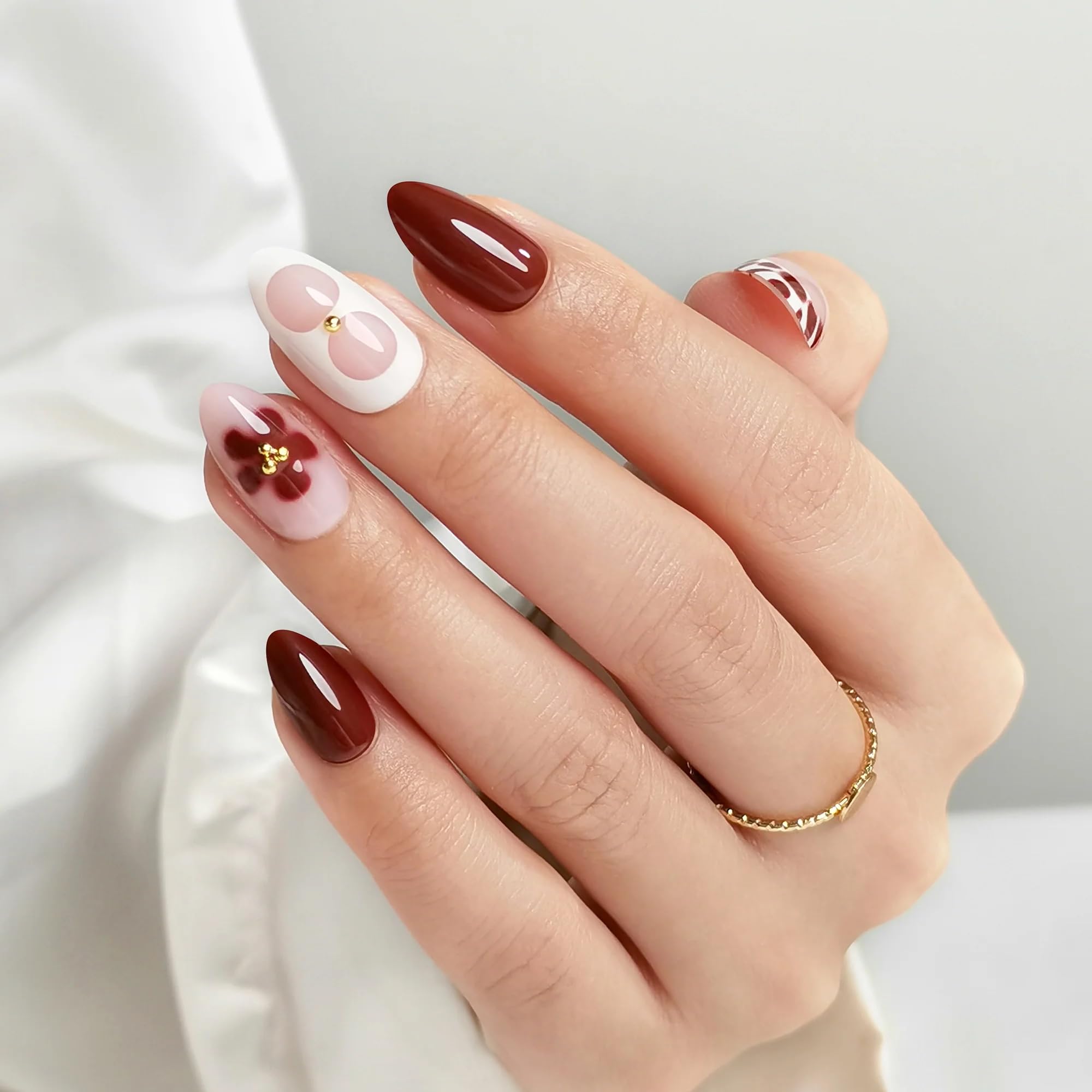 RPNZL Blossom nails with floral design and almond shape for elegant everyday wear.