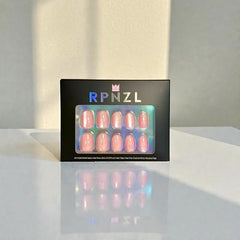RPNZL Cat-eye light pink nails with shimmering depth.
