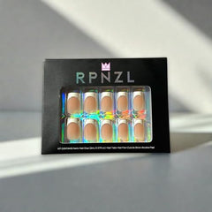 RPNZL Ivory French Tip press-on nails with a UV-protected glossy finish.