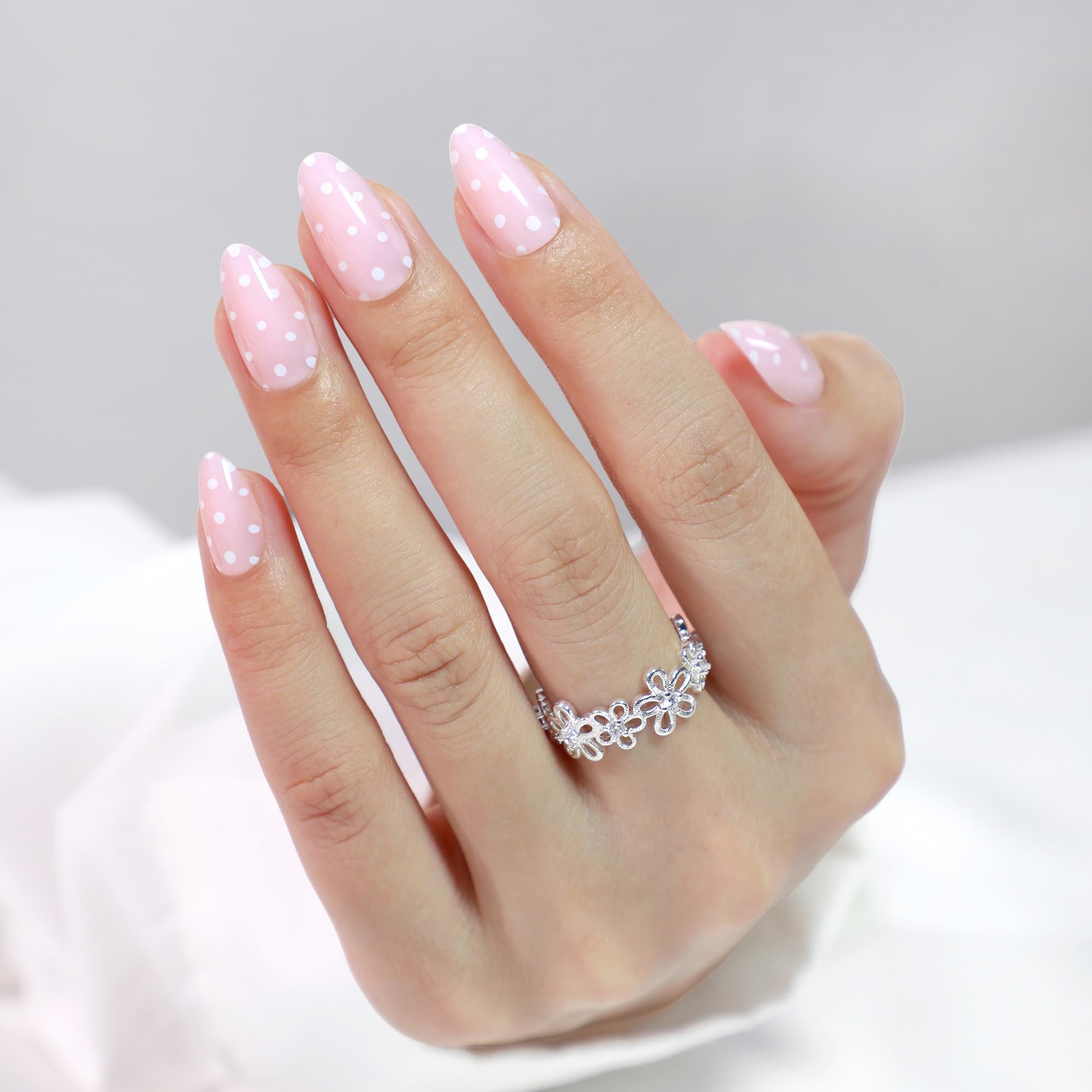 RPNZL Sugar Pink Polka Dot UV finish almond nails for a salon-like home manicure.