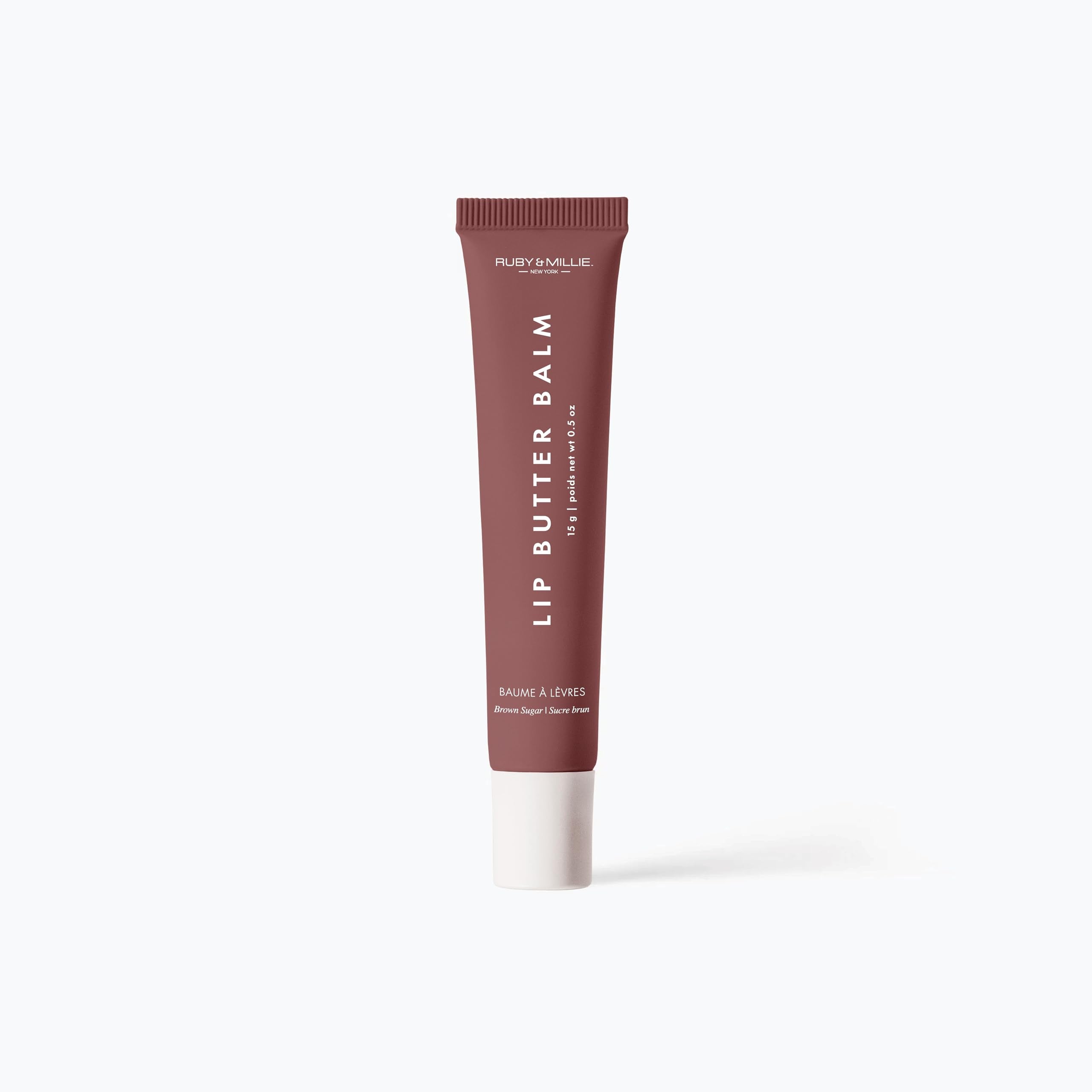 Ruby & Millie compact 0.5 oz lip balm for on-the-go care.