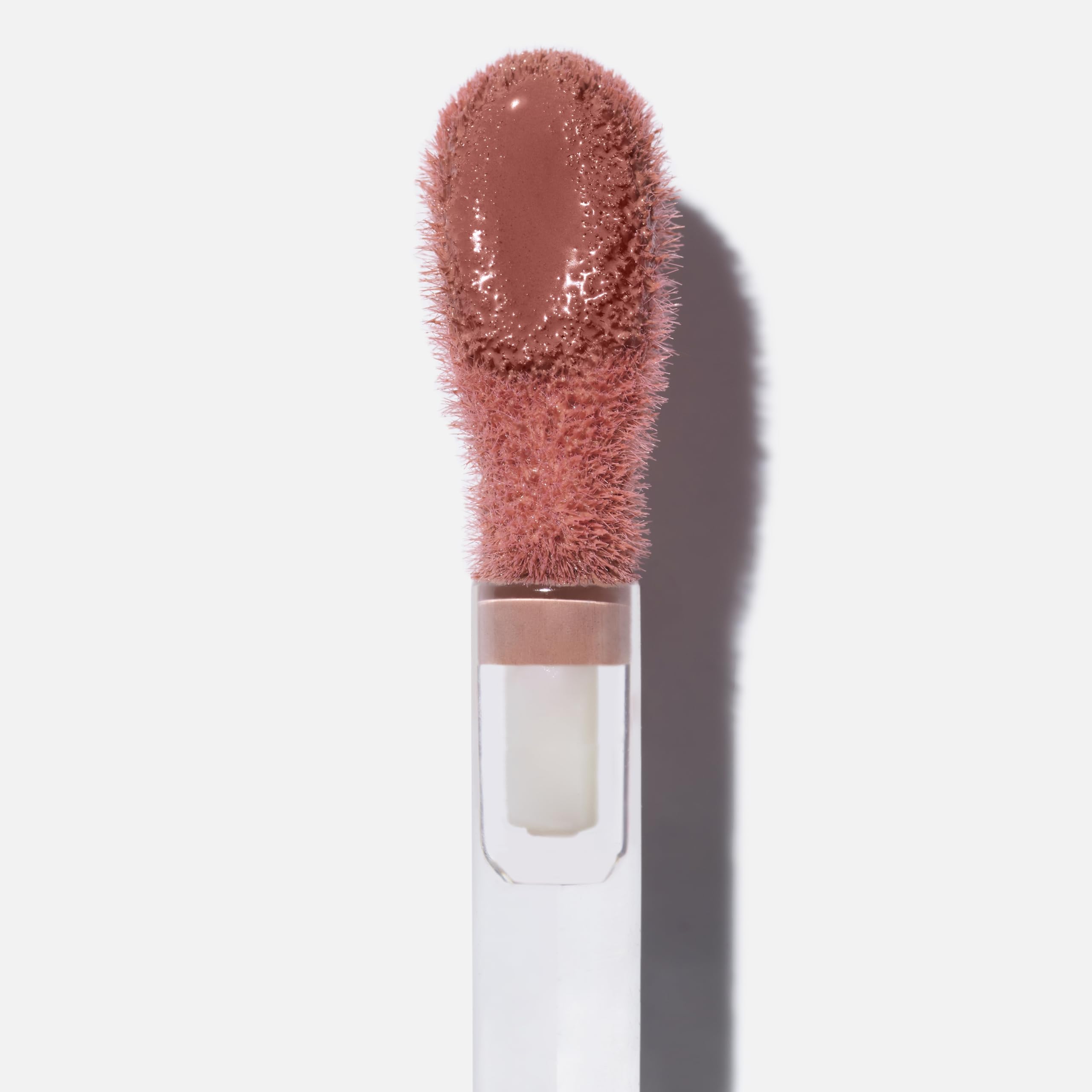 Saie Dew Liquid Blush on cheeks delivers a subtle, radiant flush.