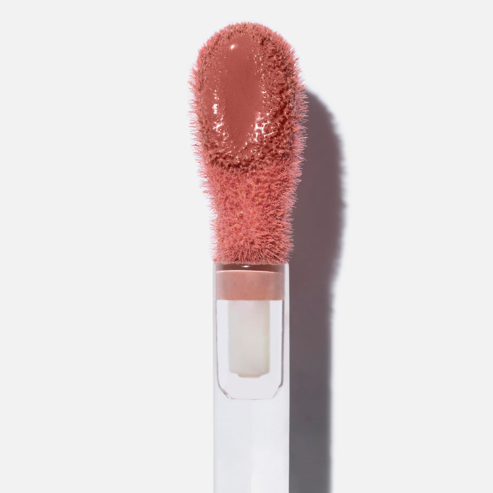 Saie Dew Liquid Blush on cheeks delivers a subtle, radiant flush.