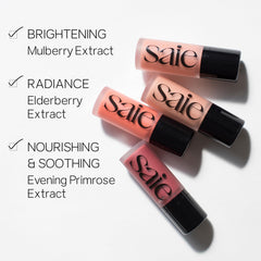 Saie Dew Liquid Blush swatched on cheeks for buildable color and glow.